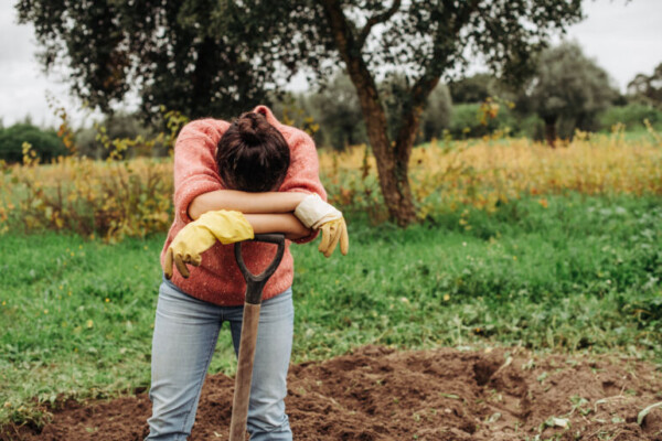 Female,Farmer,Looking,Tired,After,Day,Of,Work,On,The